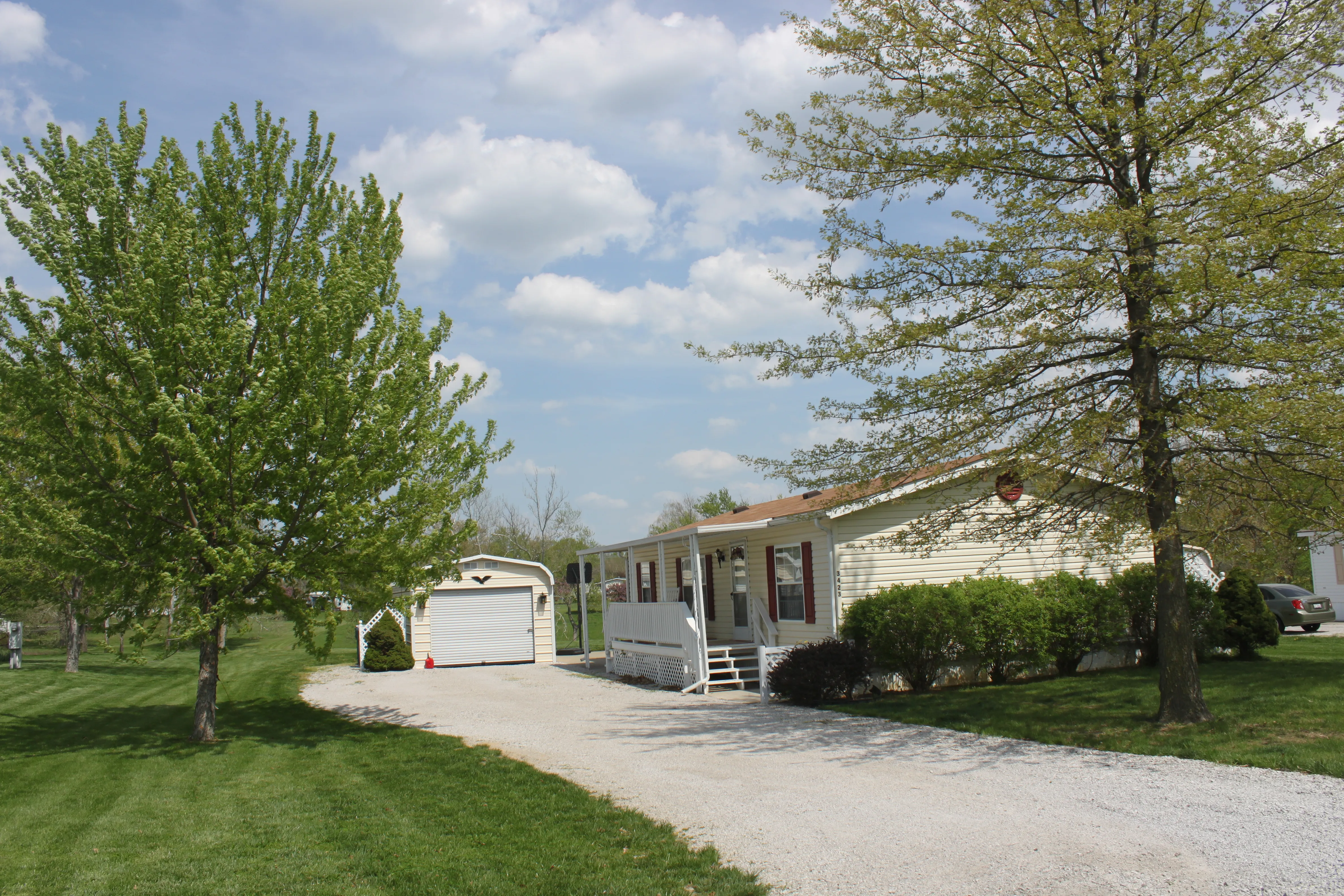 White house with gravel driveway